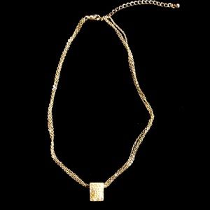 Triple silver tone necklace with rhinestone pendant